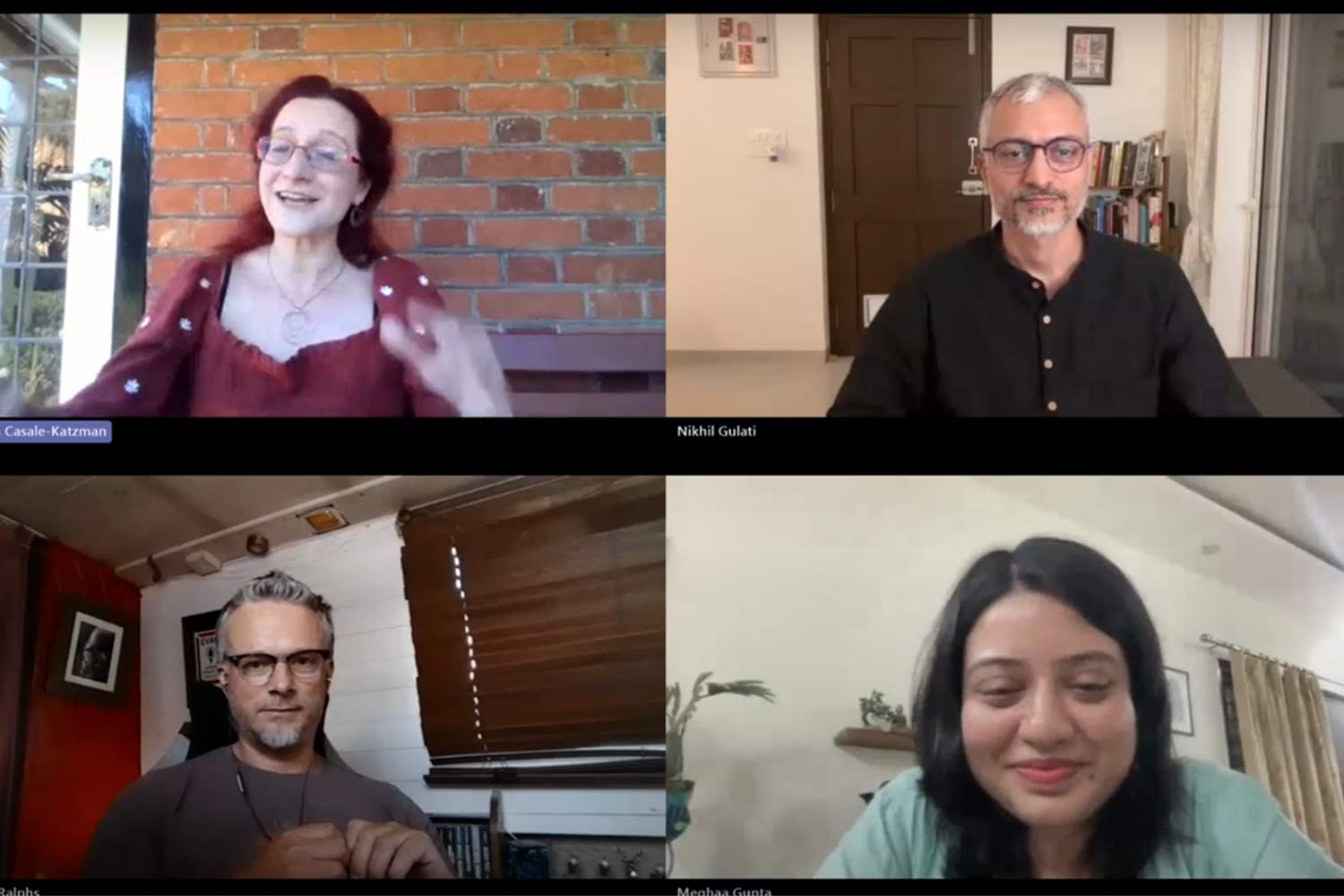 Screenshot of four individuals in a video call