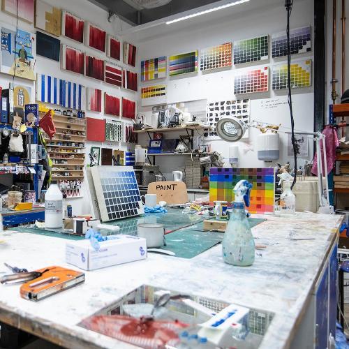 A room filled with various paints and painting tools