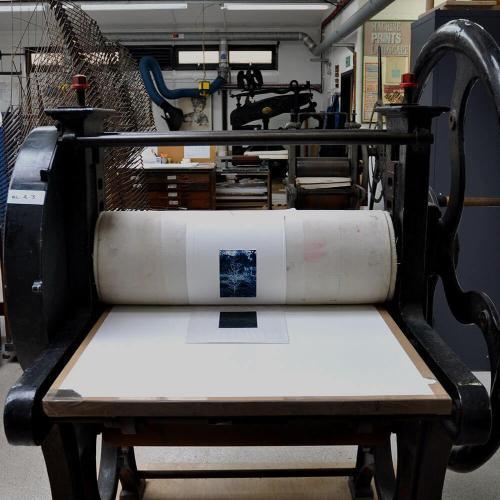 A photo of an etching press