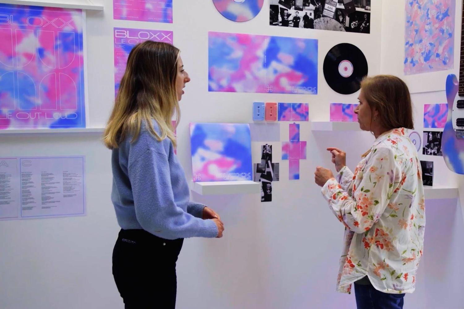 Two people looking at a marketing presentation