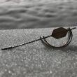 Crescent moon pin placed on snow