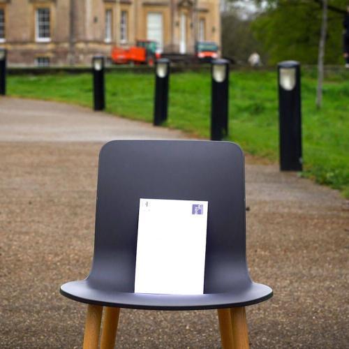 A chair with an envelope on it at Newton Park campus