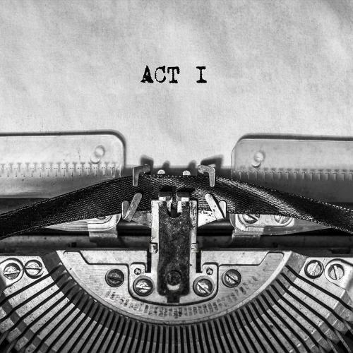 A page on a typewriter with the words 'Act 1' on it