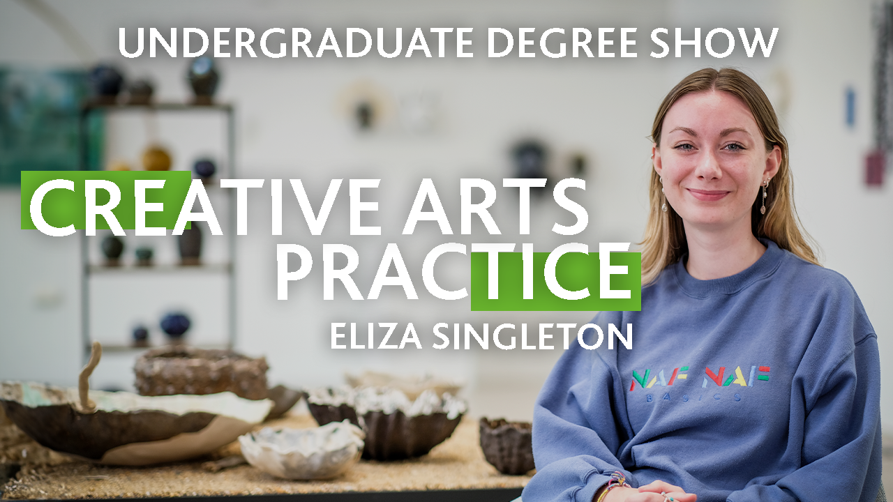 A person wearing a blue sweatshirt smiles at the camera, with text that reads: Eliza Singleton, Creative Arts Practice, Undergraduate Degree Show