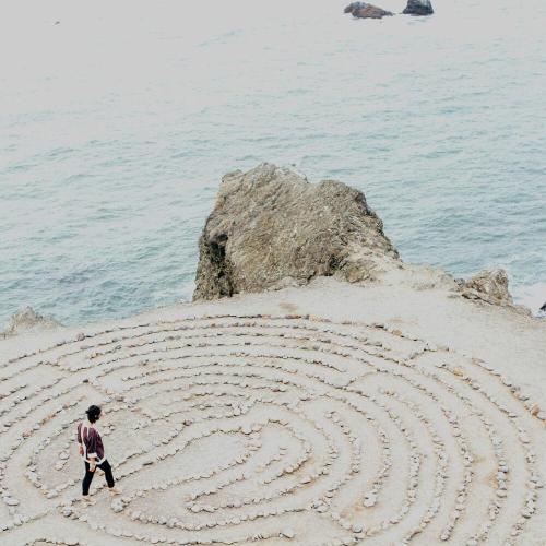 Pebble maze on a beach.